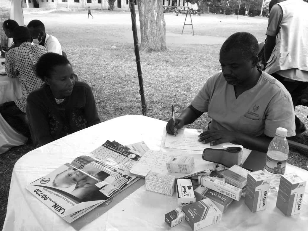 PATIENT CONSULTING WITH DOCTOR MUKASA GAURD - Atuwaire